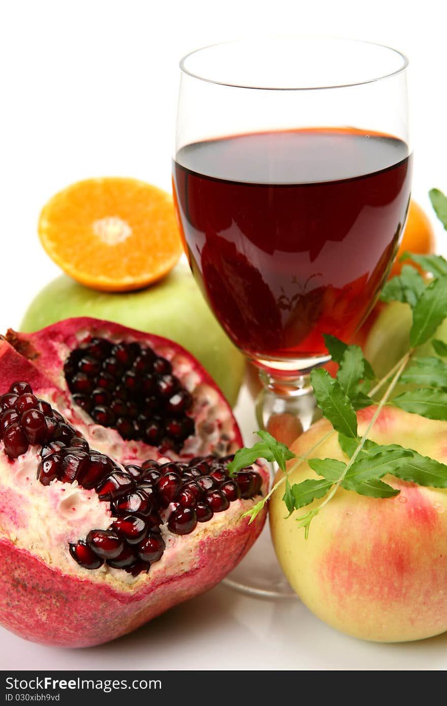 Fresh fruit and juice on a white background