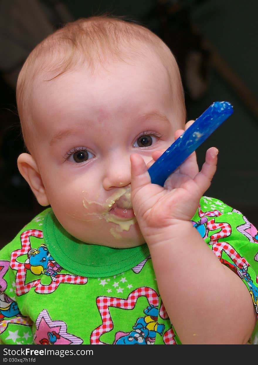 Photo of the eating boy with smile on face