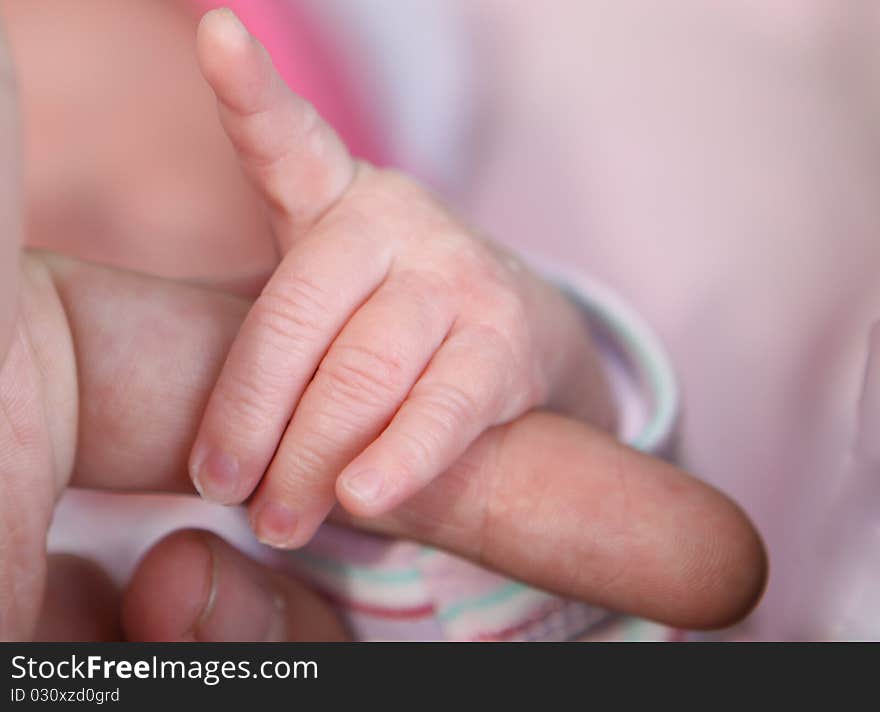 Newborn baby hand pointing with the finger. Newborn baby hand pointing with the finger