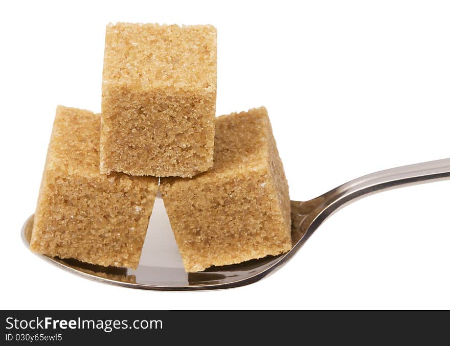 Cube of brown sugar on spoon