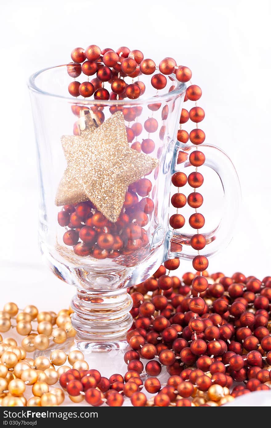 Golden christmas star and colorful bows on the white background