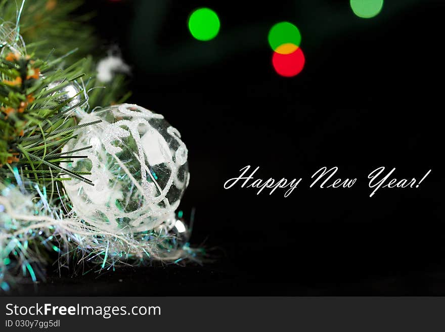 Transparent christmas ball with a christmas tree on the black background. Transparent christmas ball with a christmas tree on the black background