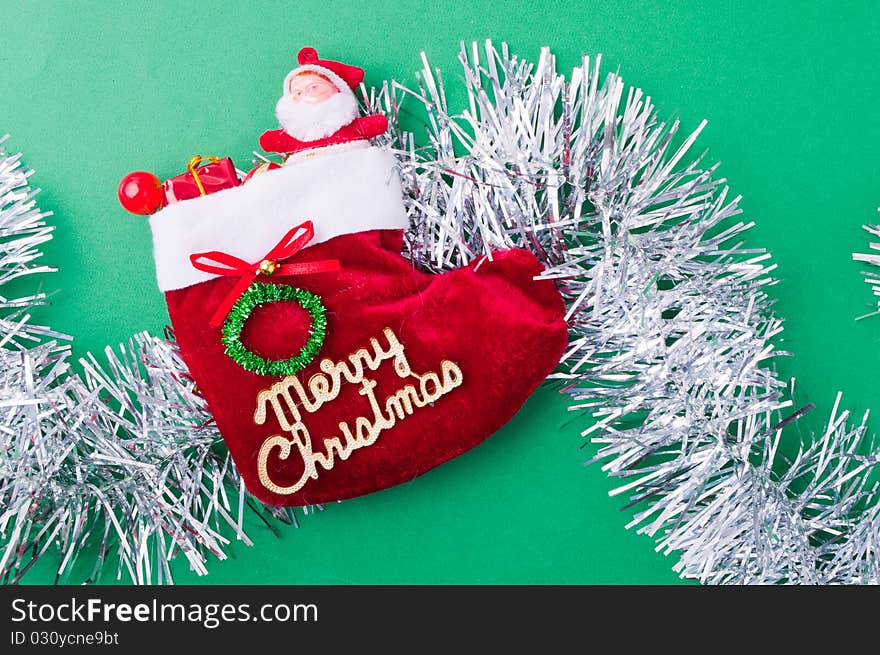 Christmas decoration objects on light green background. Christmas decoration objects on light green background