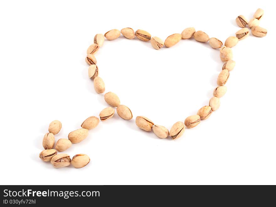 Heart of the pistachios on a white background