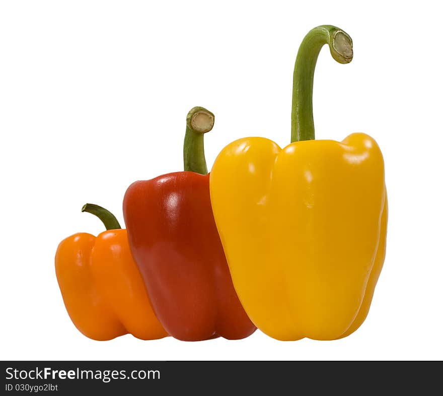 Green, red, orange peppers isolated on the white background. Green, red, orange peppers isolated on the white background