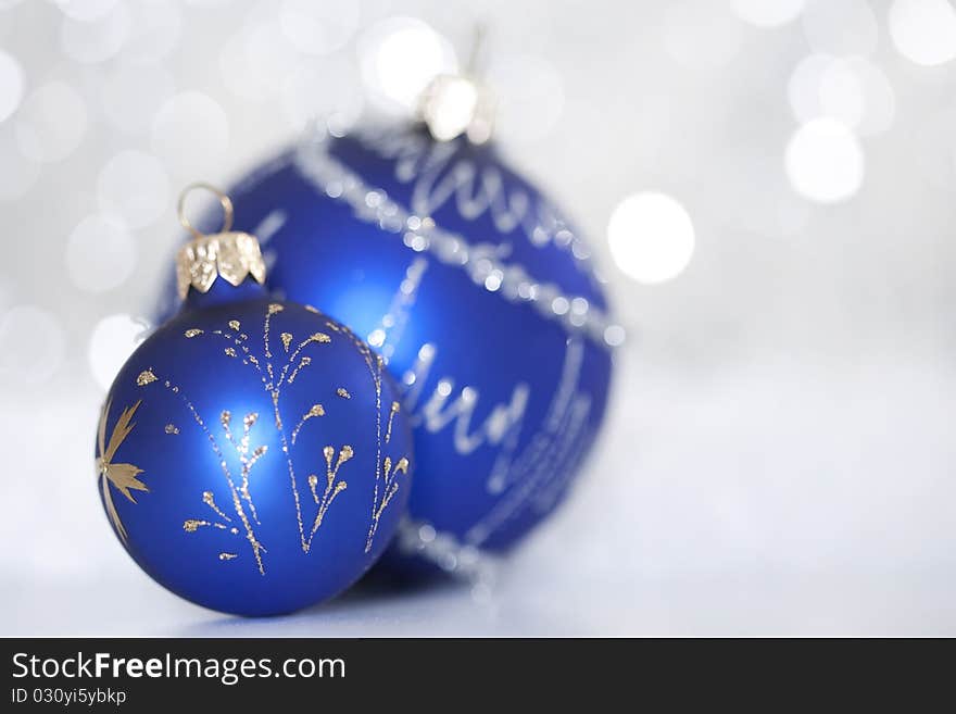 Blue christmas ball on abstract light background. Blue christmas ball on abstract light background.