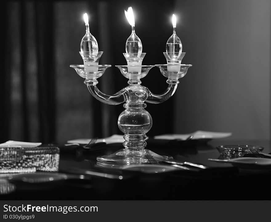 Candle lights on the table in the restaurant, b&w