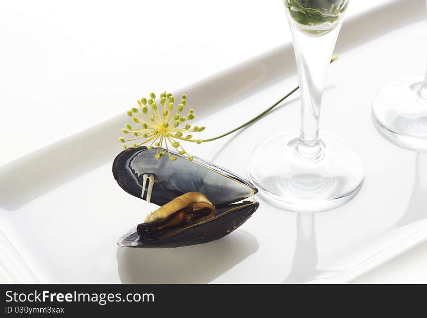 Boiled mussels on white plate