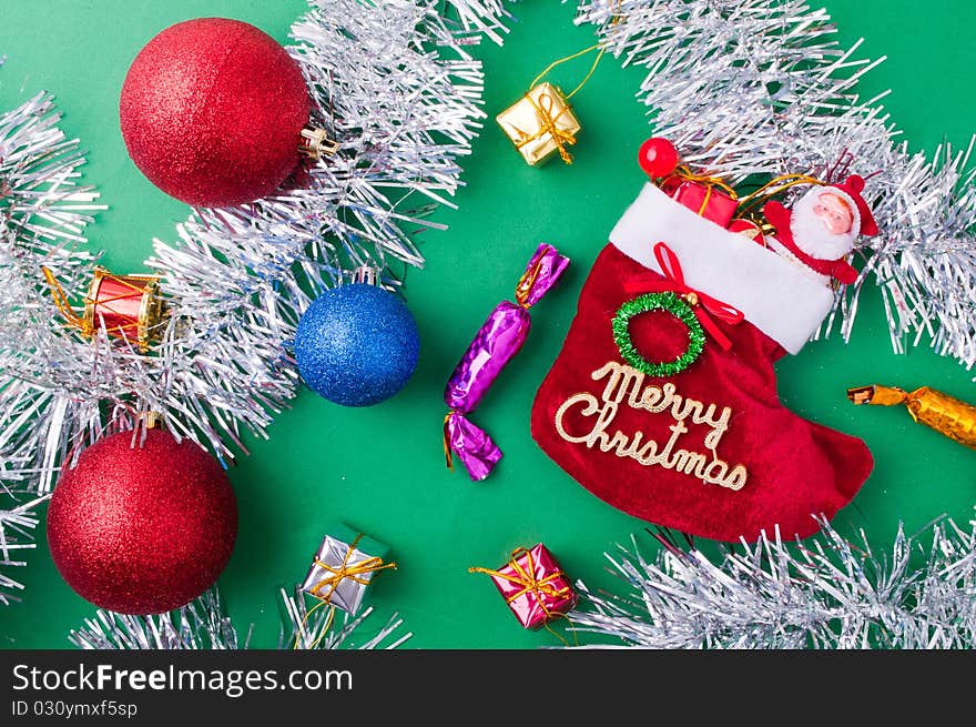 Christmas decoration objects on light green background. Christmas decoration objects on light green background