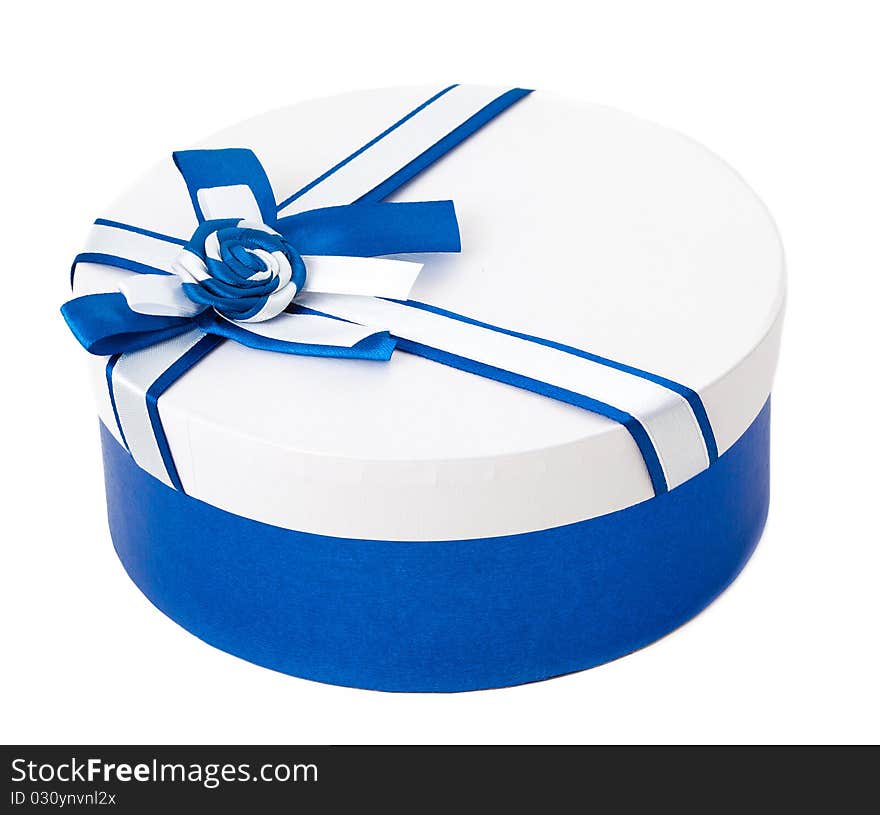 Round shape gift box with blue ribbon and bow isolated