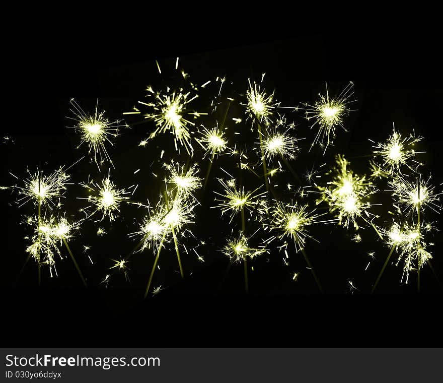 Burning sparkler on New Year�s Eve. Burning sparkler on New Year�s Eve