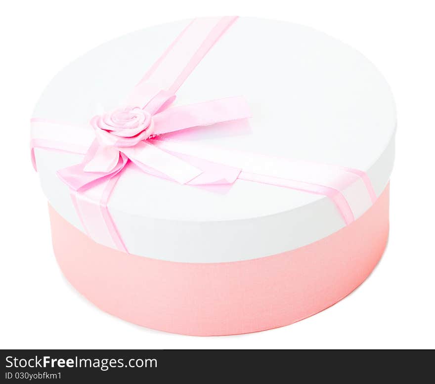 Round shape gift box with pink ribbon and bow isolated