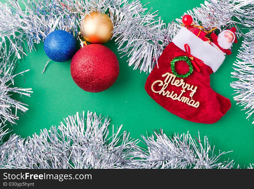 Christmas decoration objects on light green background. Christmas decoration objects on light green background