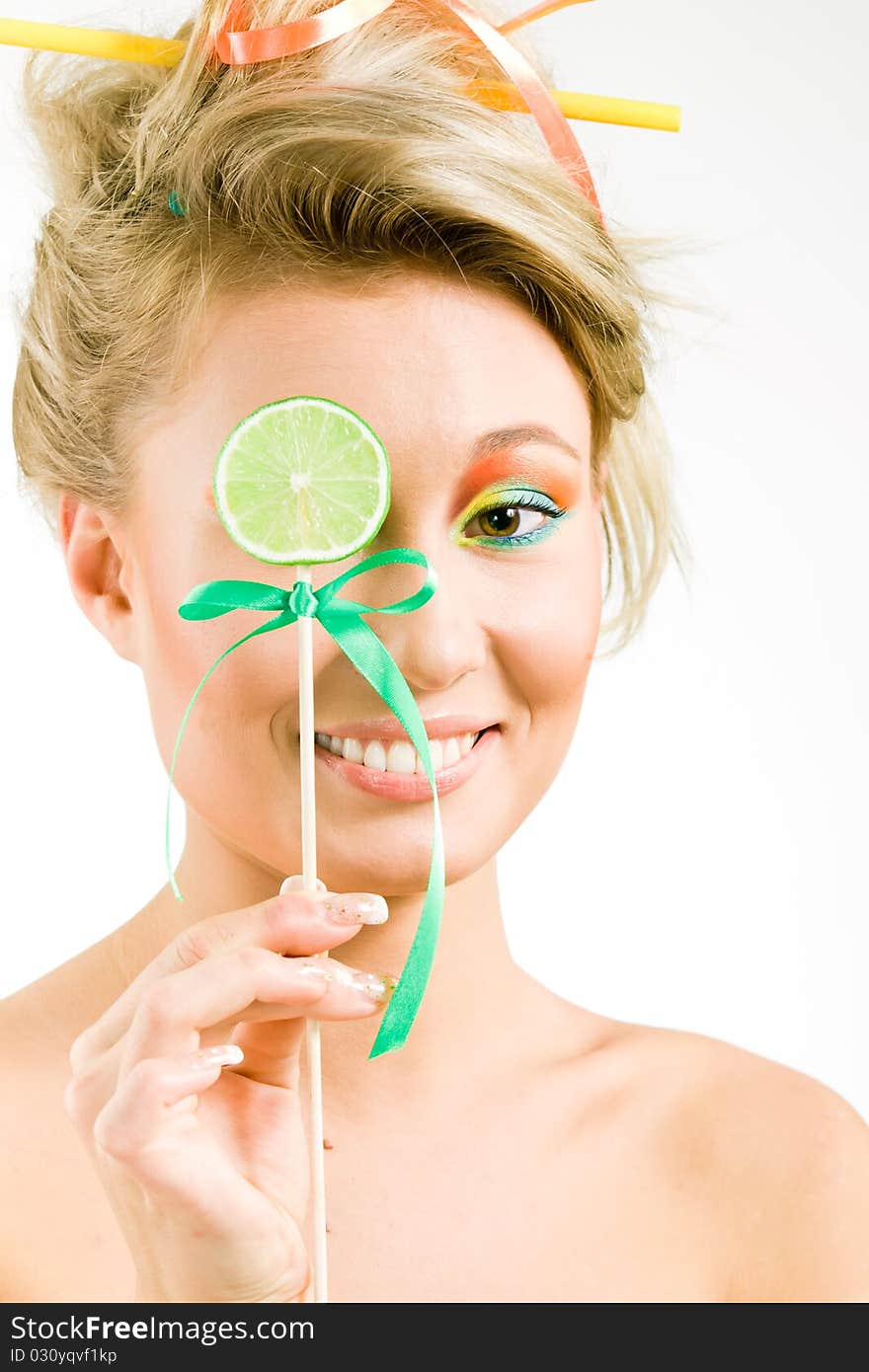 Beauty girl and a piece of lime on a stick. Beauty girl and a piece of lime on a stick