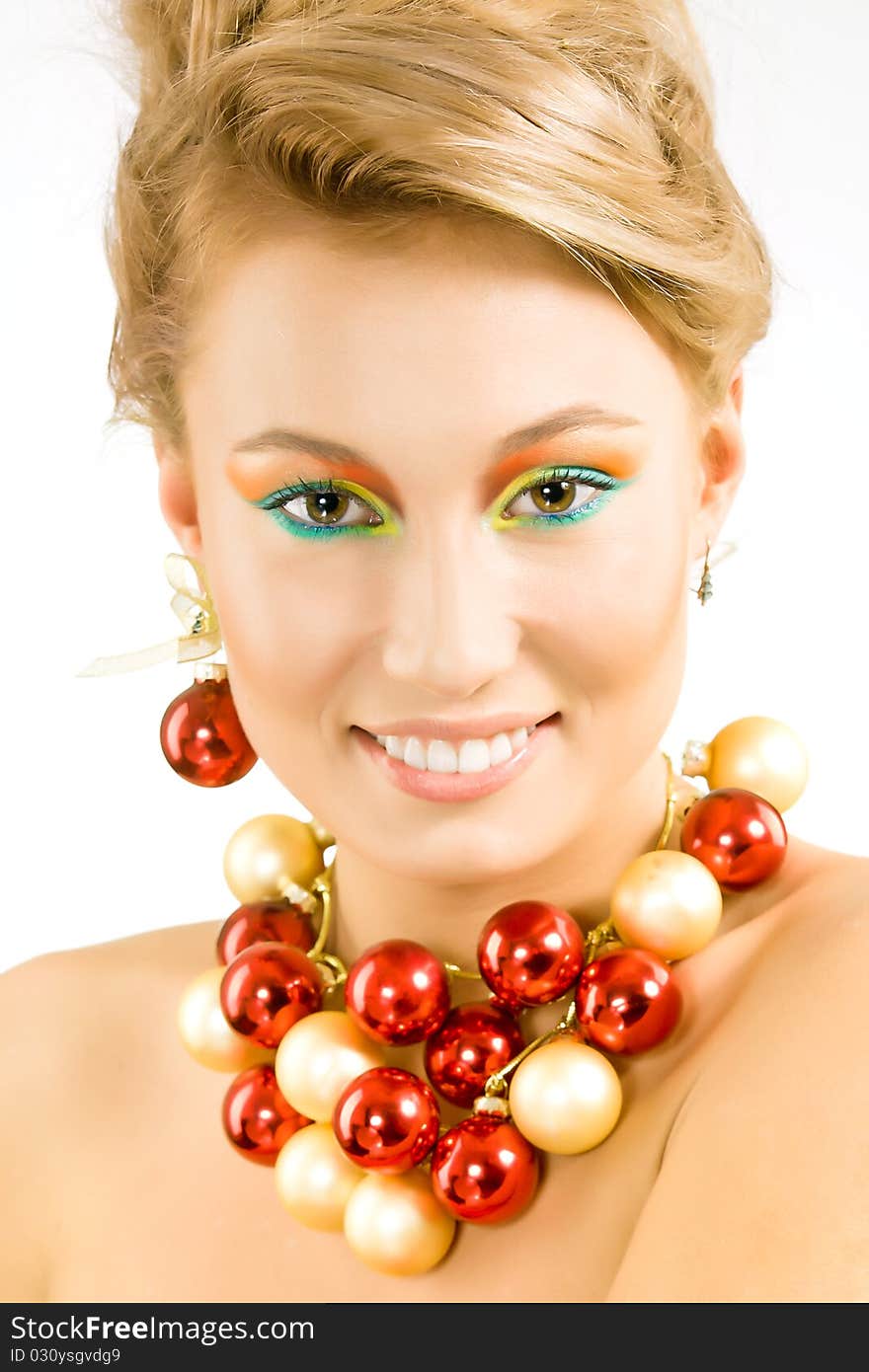 Attractive smiling young woman with necklace from xmas balls. Attractive smiling young woman with necklace from xmas balls