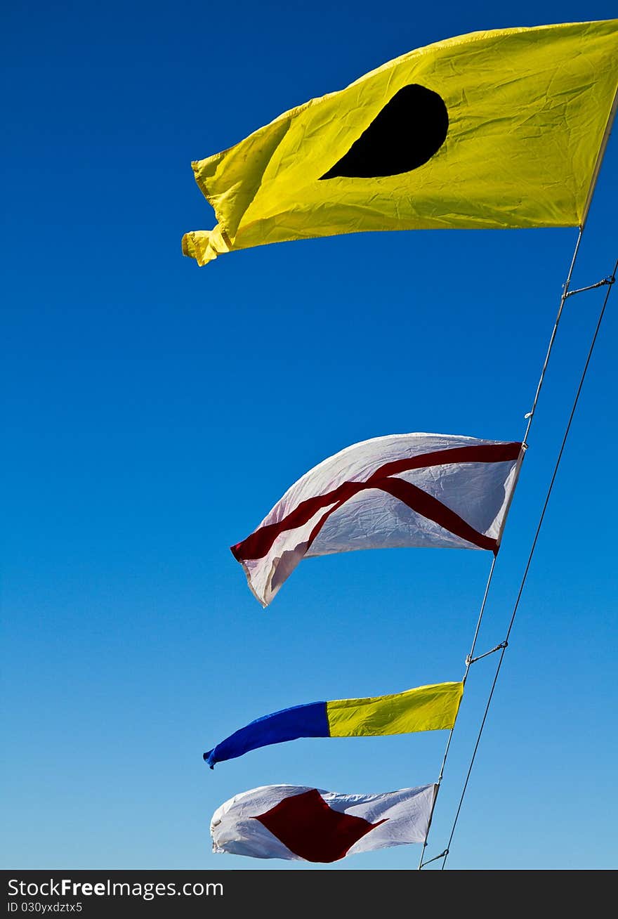 International code flags flying on a windy day