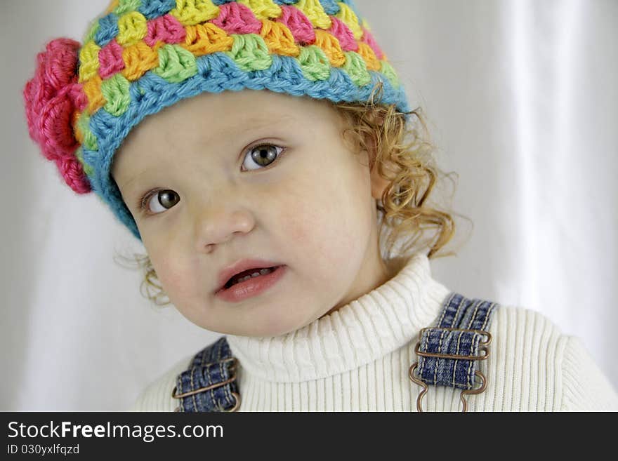 Young girl looking at the camera, inquisitive. Young girl looking at the camera, inquisitive.