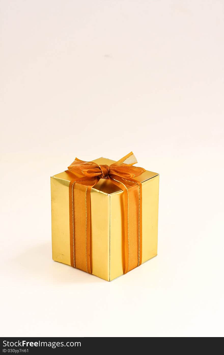 Golden gift on the white background