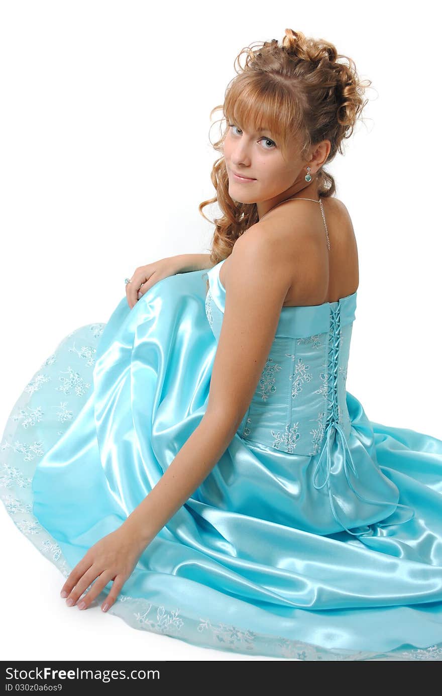 Female model wearing a blue dress, isolated on a white background. Female model wearing a blue dress, isolated on a white background