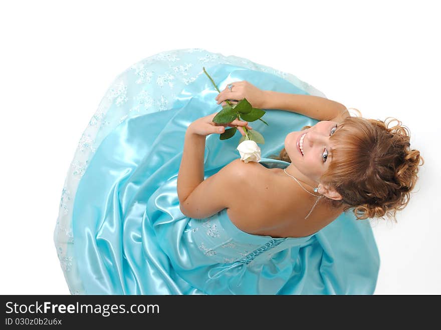 Female model wearing a dress, holding a white rose. Female model wearing a dress, holding a white rose