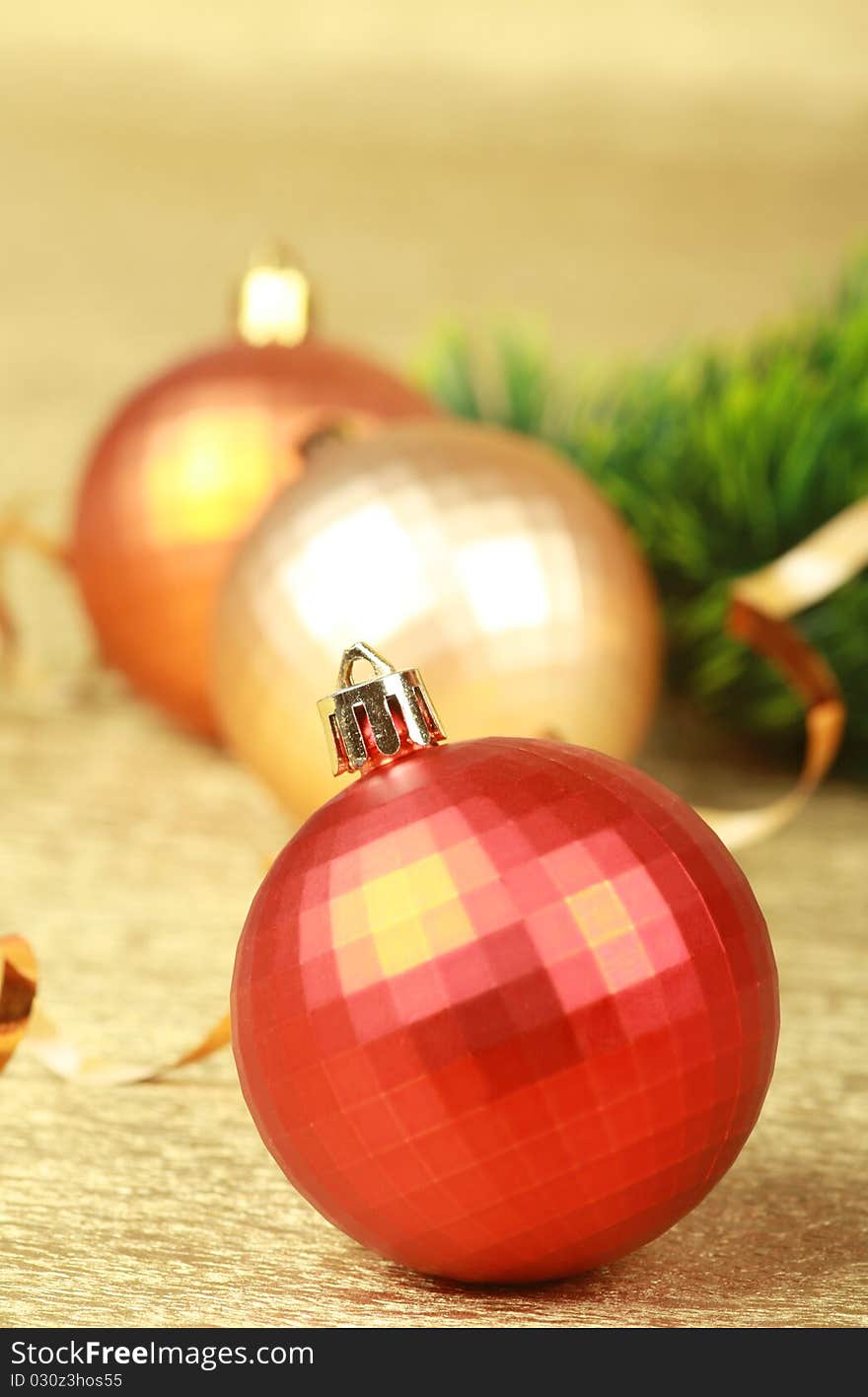 Color christmas balls on golden background