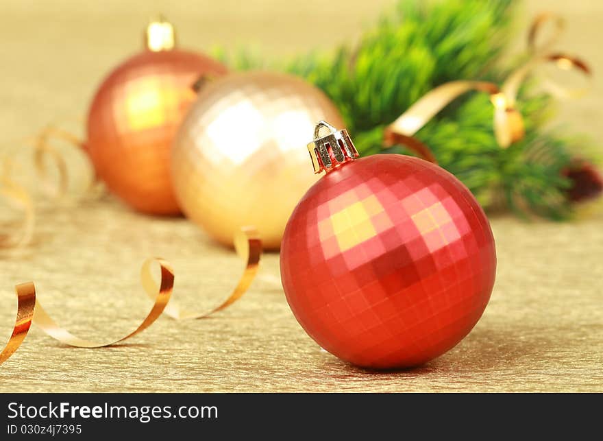 Color christmas balls on golden background