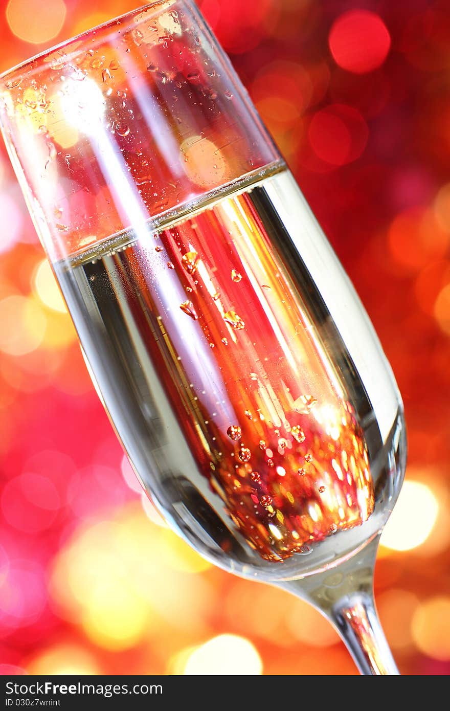 Champagne in glass at the christmas background. Close up