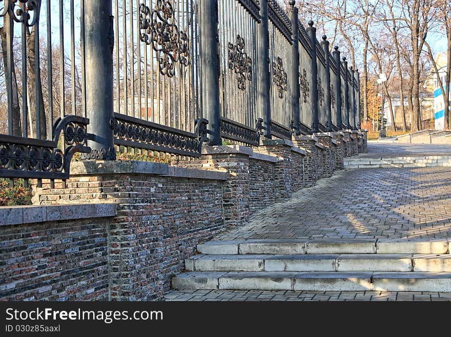 Forged metal fence in the city park