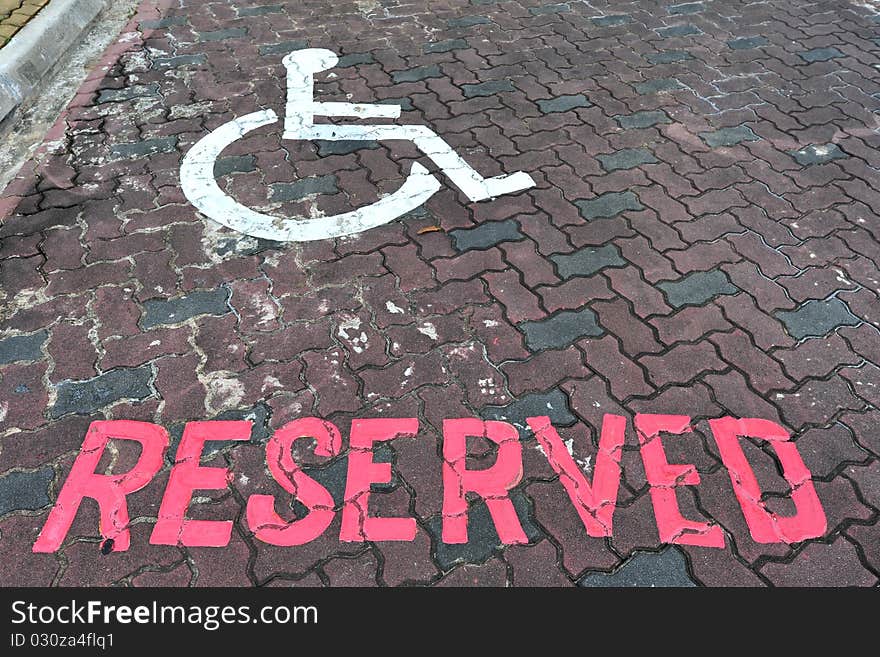 Reserved Car Parking Lot For The Handicap With Wheel Chair Sign. Reserved Car Parking Lot For The Handicap With Wheel Chair Sign