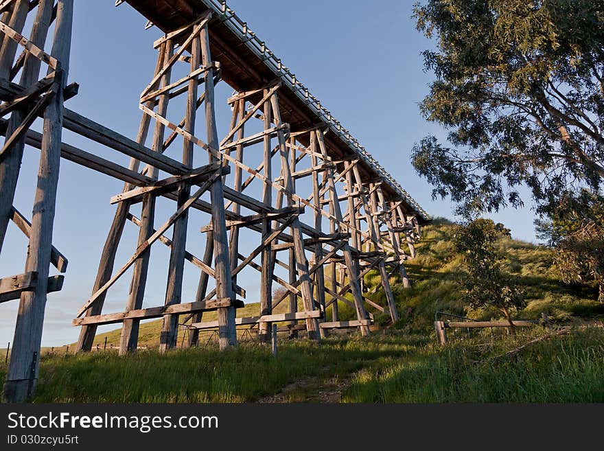 A hand built railway bridge built circa 1880 in the morning glow of sunrise. A hand built railway bridge built circa 1880 in the morning glow of sunrise.