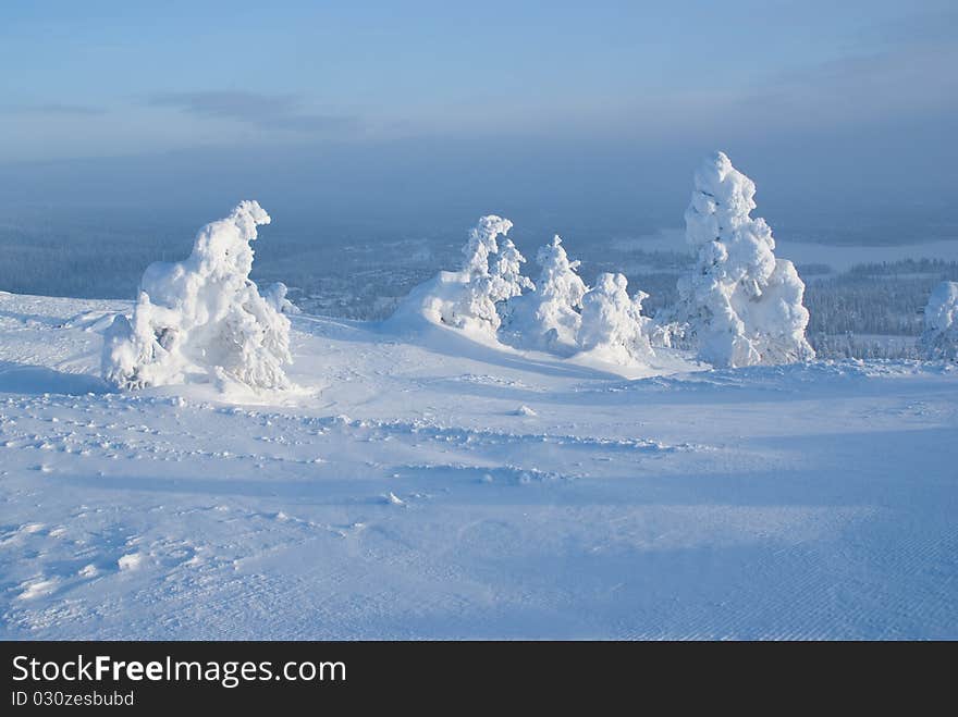 Cold northern winter in the mountains, a landscape with natural snow sculptures