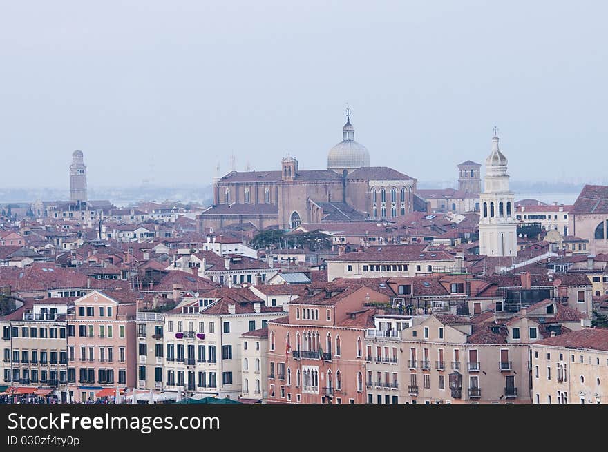 View of Venice, Italy from deck of cruise ship in the Grand Canal at dusk