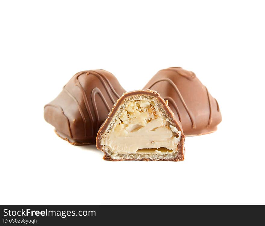 Chocolate candy with milk cream and nuts