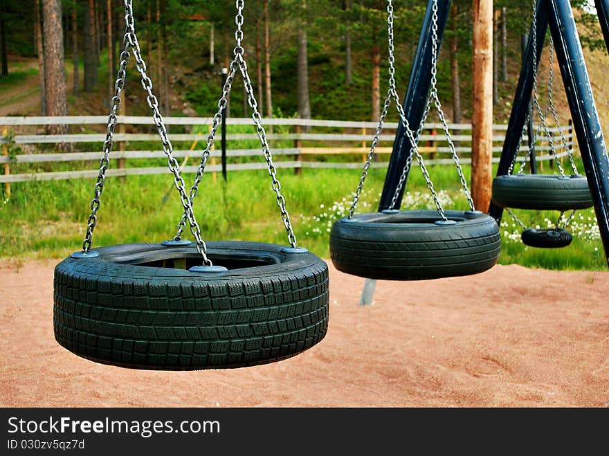 Close up of automobile tires swings