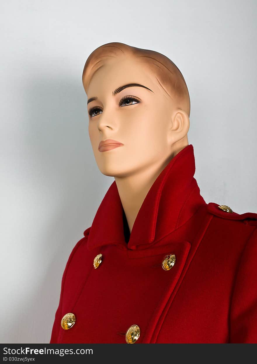 Red coat on mannequin in shop