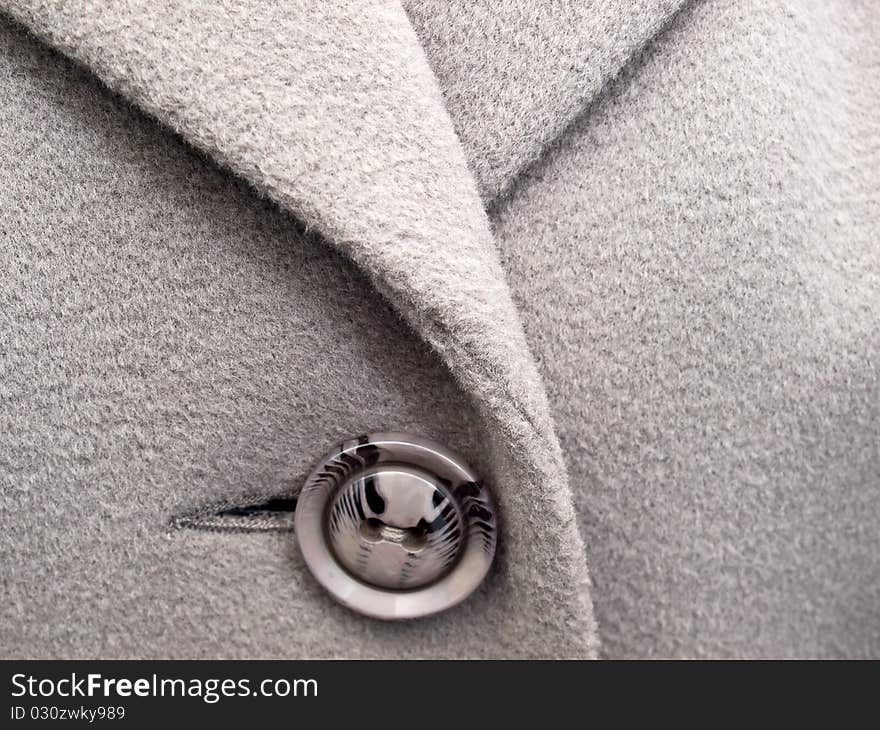 Grey button on  coat