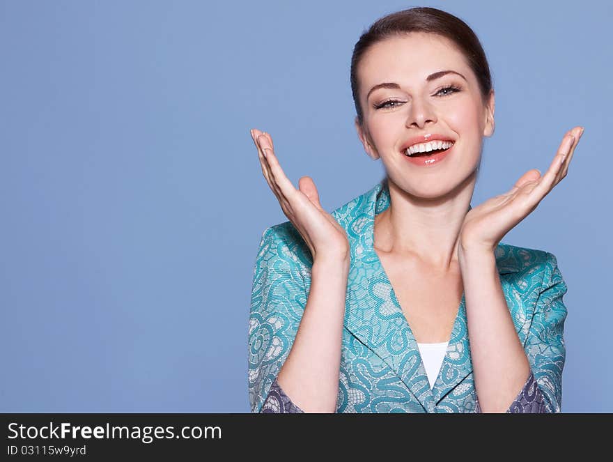 Portrait of beautiful smiling woman isolated on blue with copyspace. Portrait of beautiful smiling woman isolated on blue with copyspace