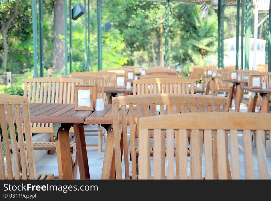 Wooden chairs and tables at a cafe