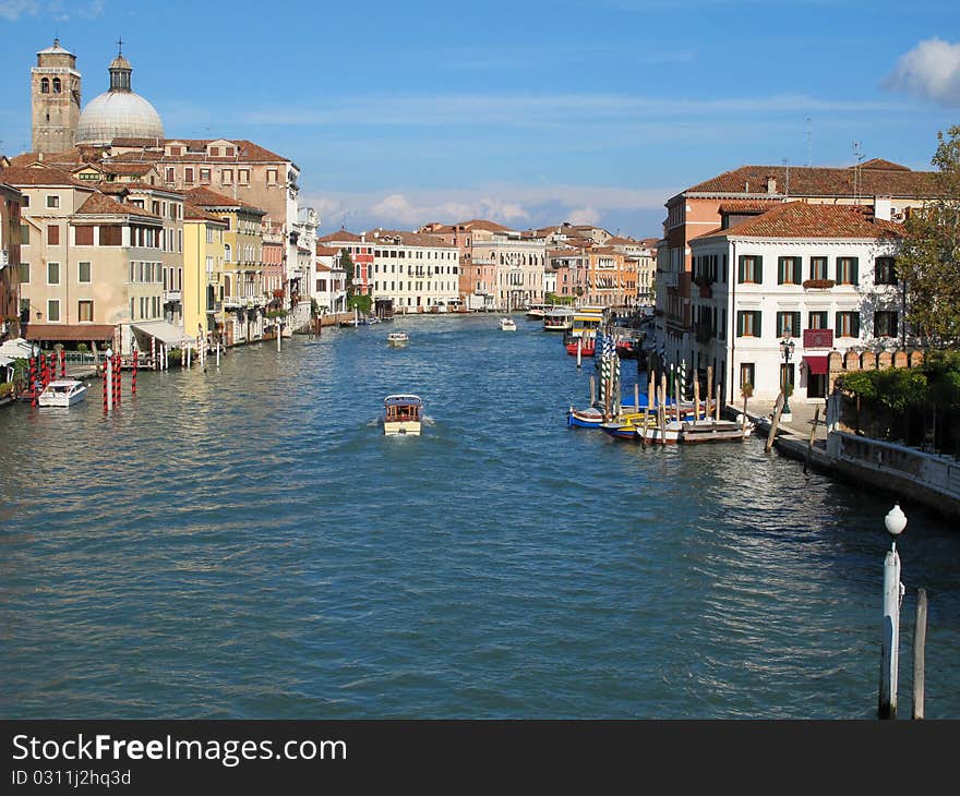 It really is grand. The Grand Canal with Blue sky at Venice in Italy , Europe. It really is grand. The Grand Canal with Blue sky at Venice in Italy , Europe