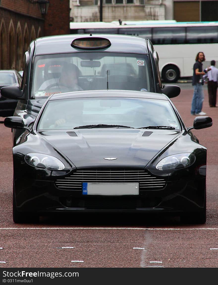 A sports car in the near of Buckingham Palace - very fast and much Power