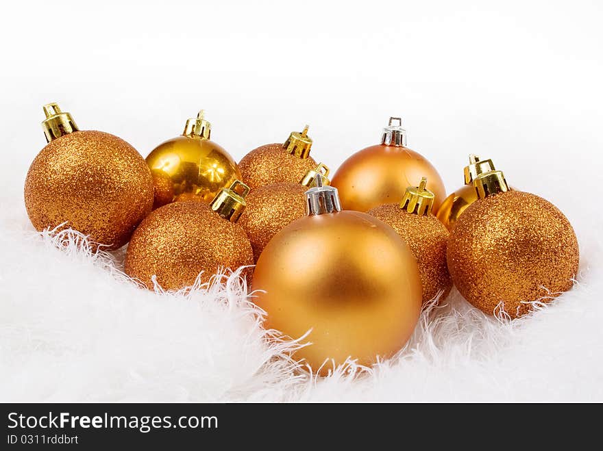 Golden orange spheres on a white fur