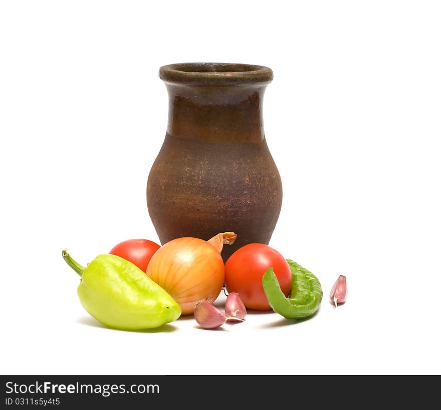 Still life with old clay jug on a white background. Still life with old clay jug on a white background.