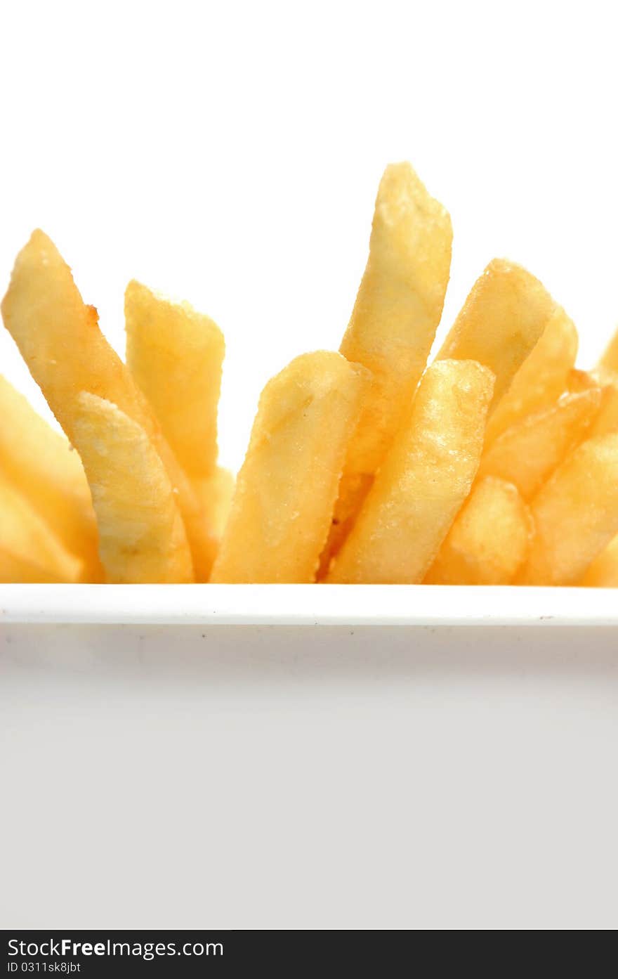 Closeup of french fries in a plastic container