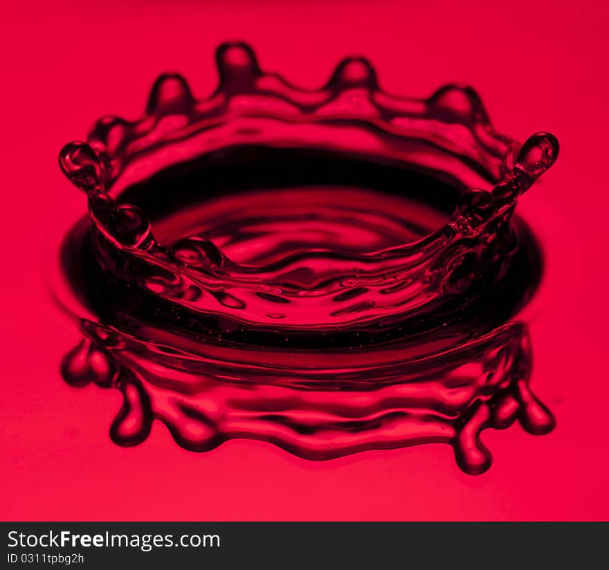 Water splashing with red background. Water splashing with red background