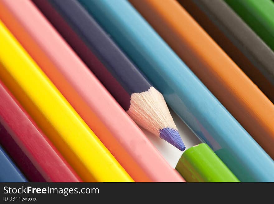 Colourful pensils on a table ready to be used.