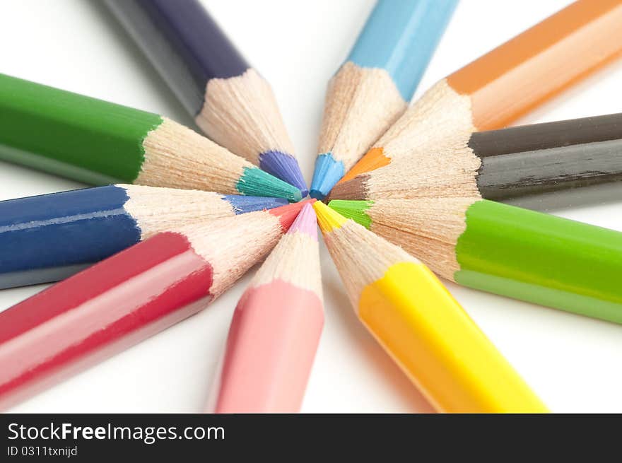 Colourful pensils on a table ready to be used.