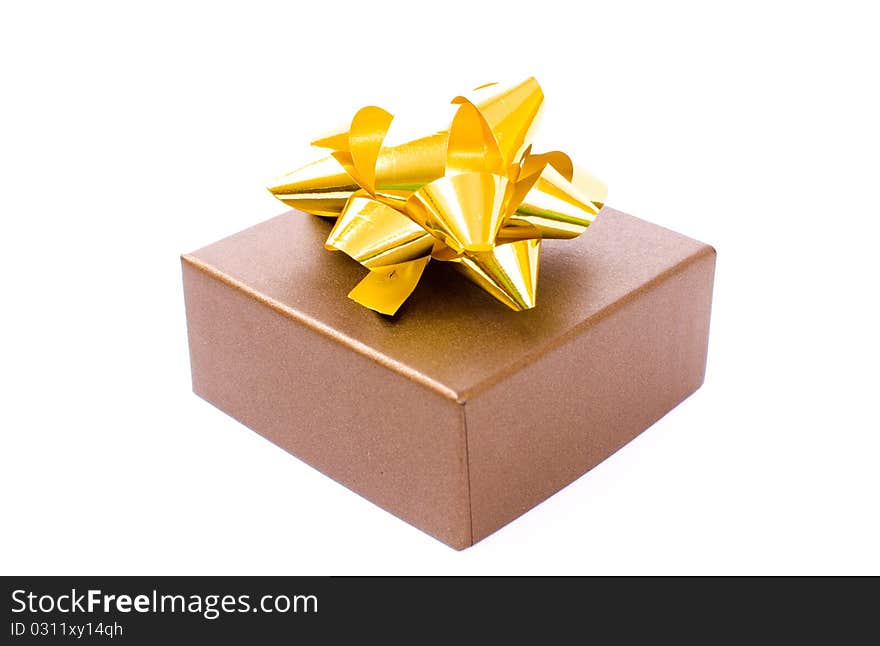 Christmas gift-box on white background, with golden ribbon