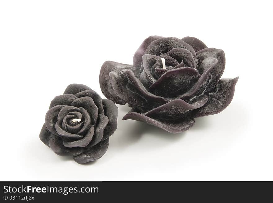 Black Candles in the shape of a flower on a white background. Black Candles in the shape of a flower on a white background