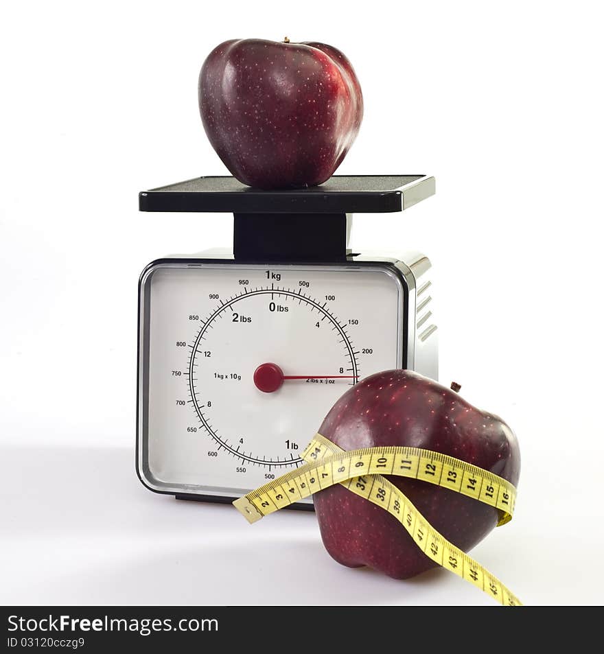 Balance with red apples on white background. Balance with red apples on white background