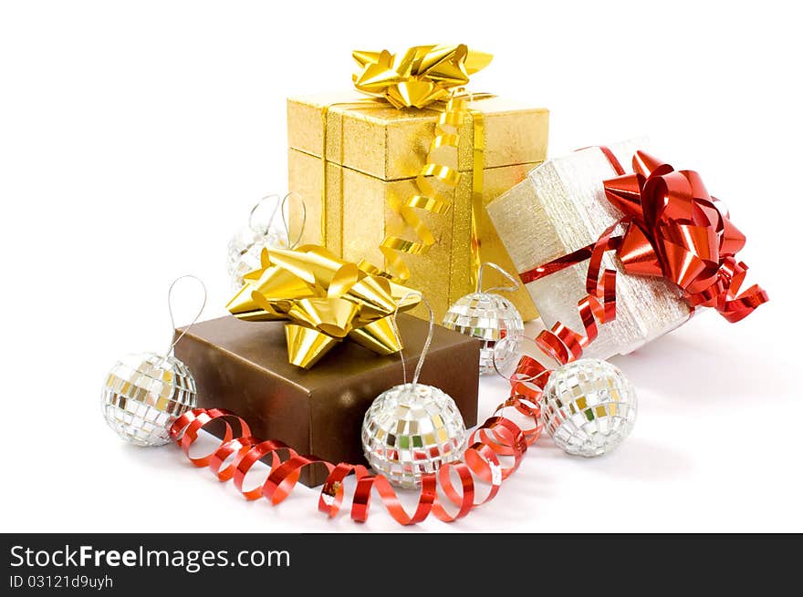 Christmas gifts - three colorful gift-boxes with ribbons and decorations